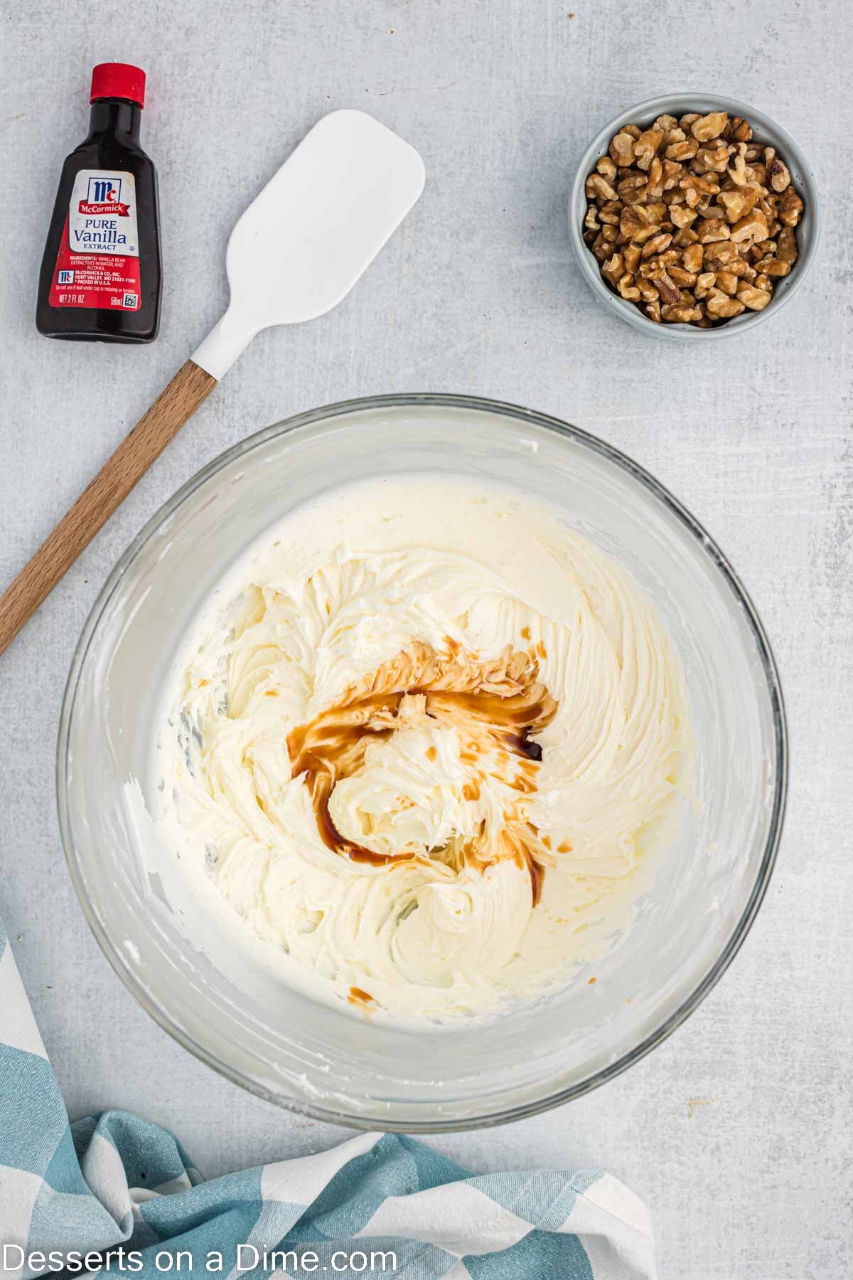 Cream cheese frosting combined in a bowl and vanilla mixed in.