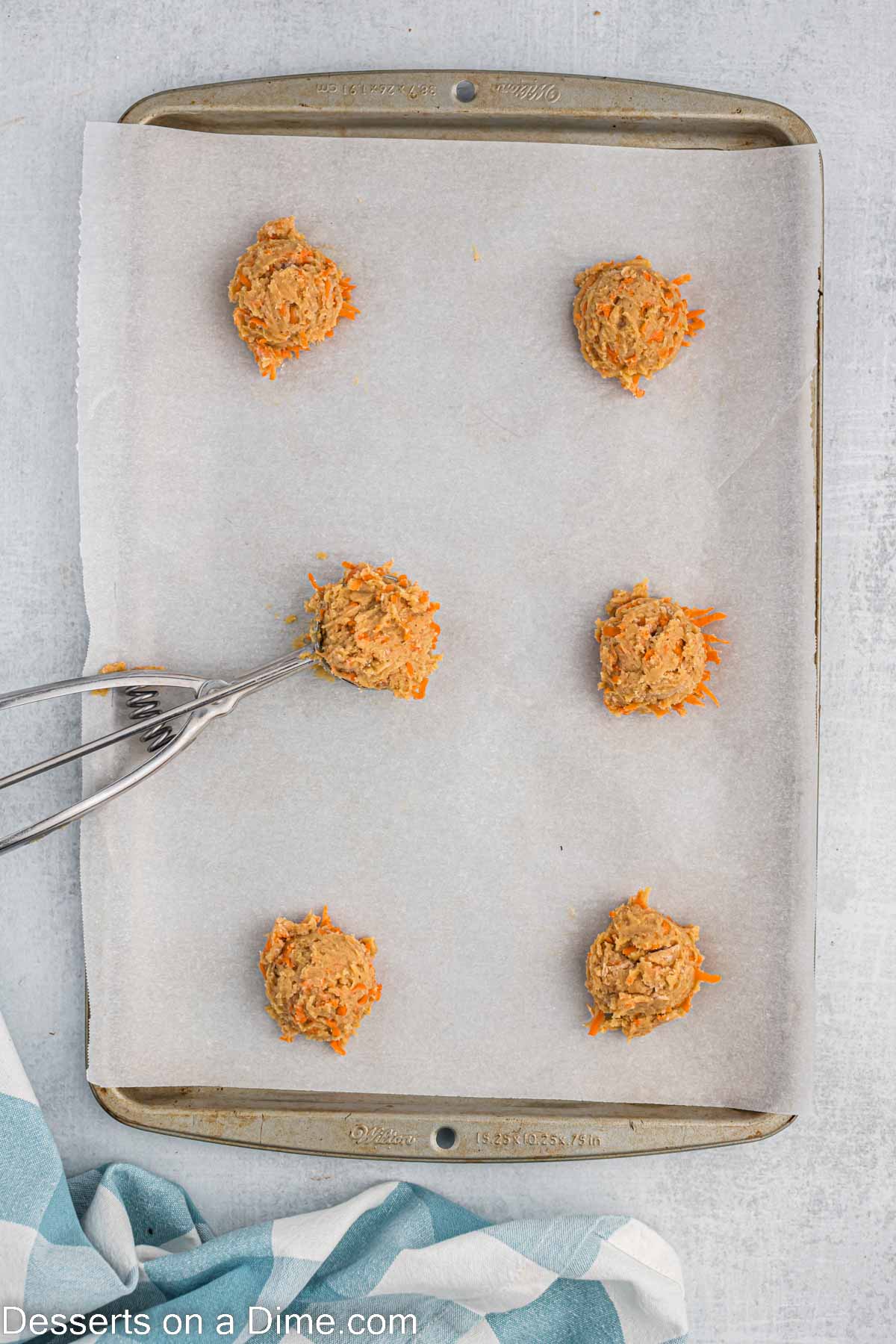 Dough scooped into balls and placed on baking sheet. 