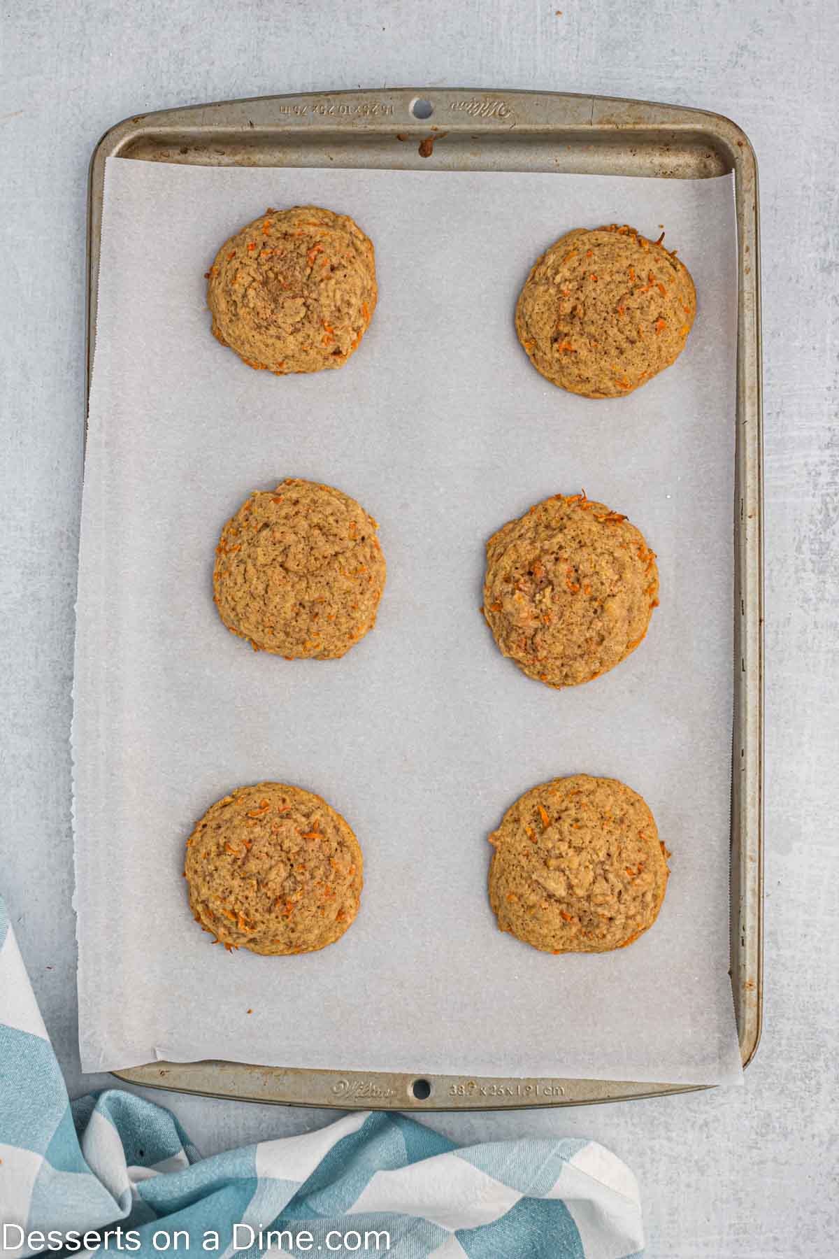 Cookies baked and cooling on baking sheet.