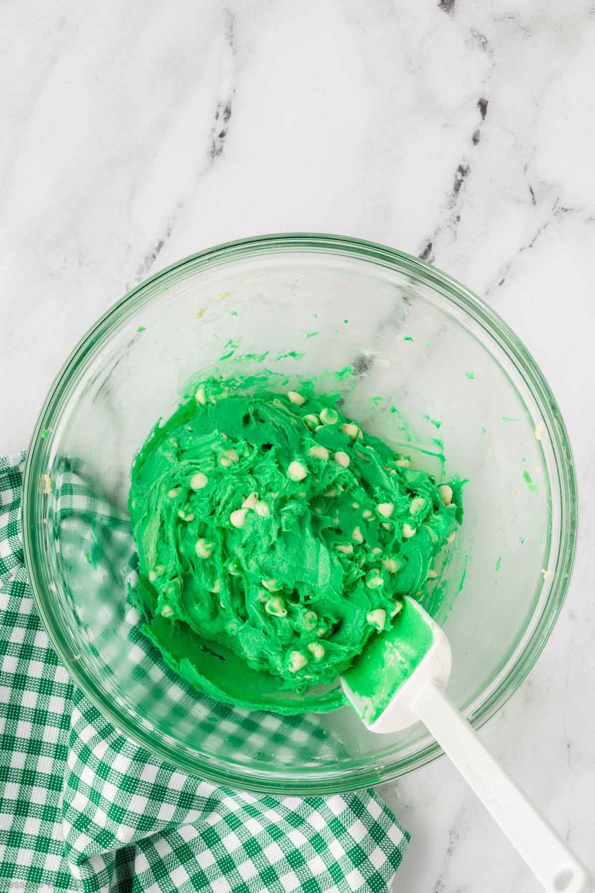 Dough mixed together with chocolate chips. 