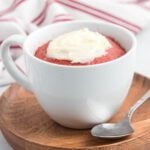 Red velvet mug cake in a white mug.