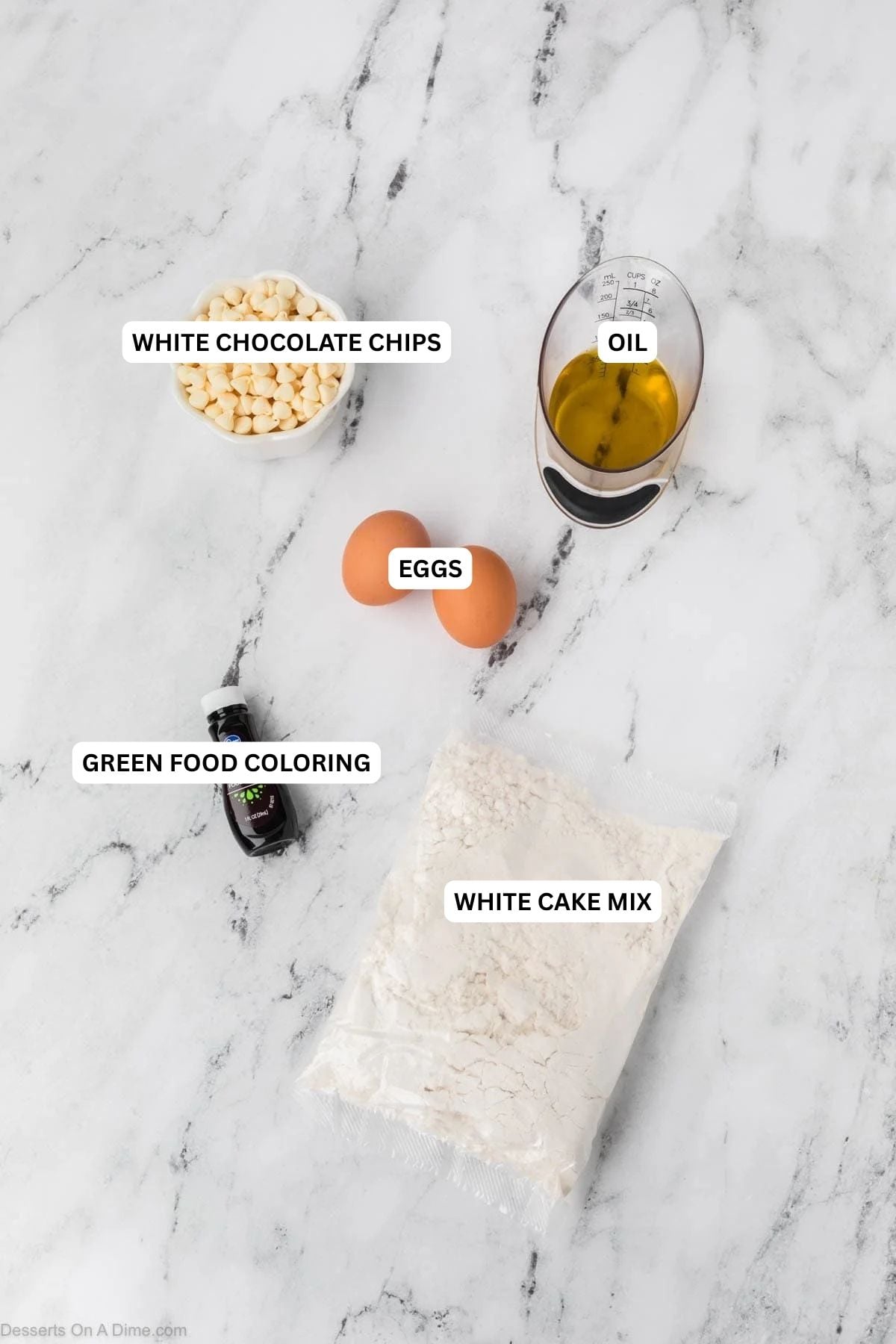 Ingredients for recipe: white chocolate chips, oil, eggs, green food coloring and white cake mix. 