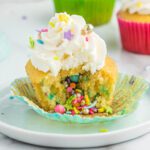 Pinata Cupcake on a white plate.