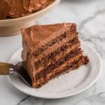 Chocolate mousse Cake on a white plate.