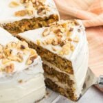 Carrot cake cut and served on a plate.
