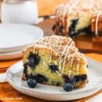 Blueberry coffee cake on a white plate.