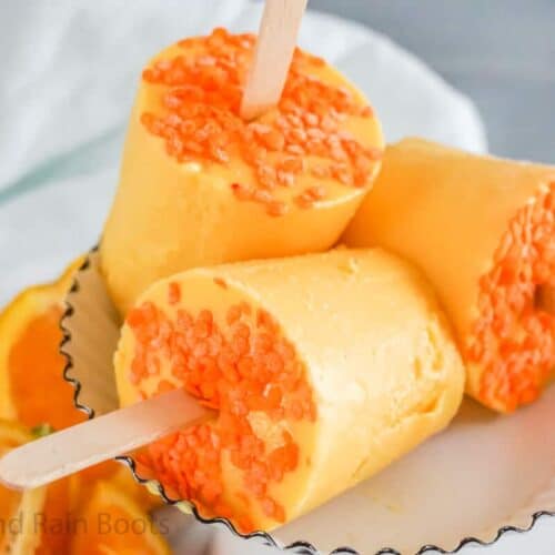 Orange popsicles grouped together.