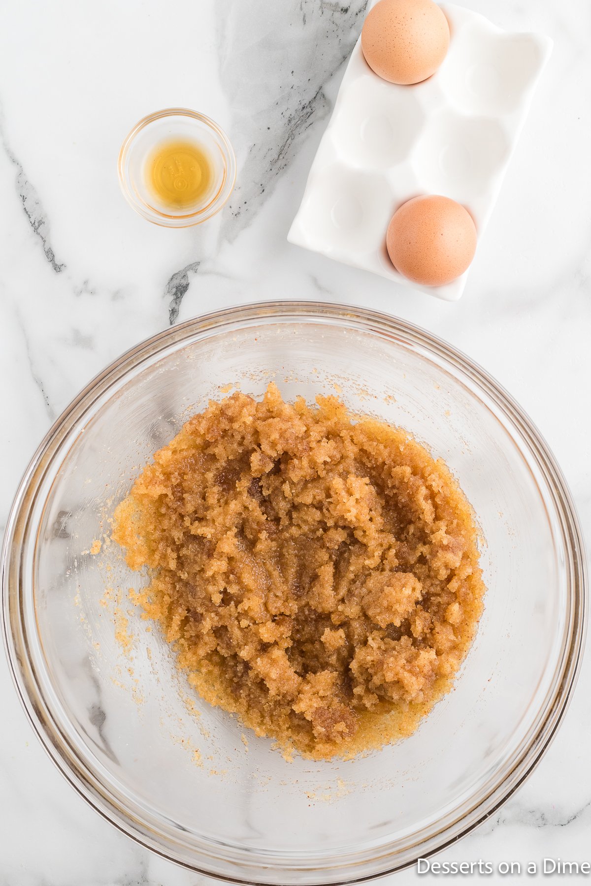 Eggs and sugar mixed into butter.