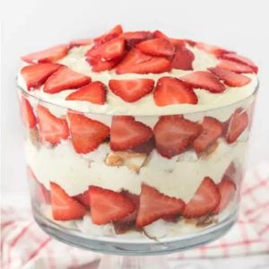 Layers of angel food cake, pudding, strawberries and more make this delicious Strawberry trifle recipe. The dessert looks gorgeous!