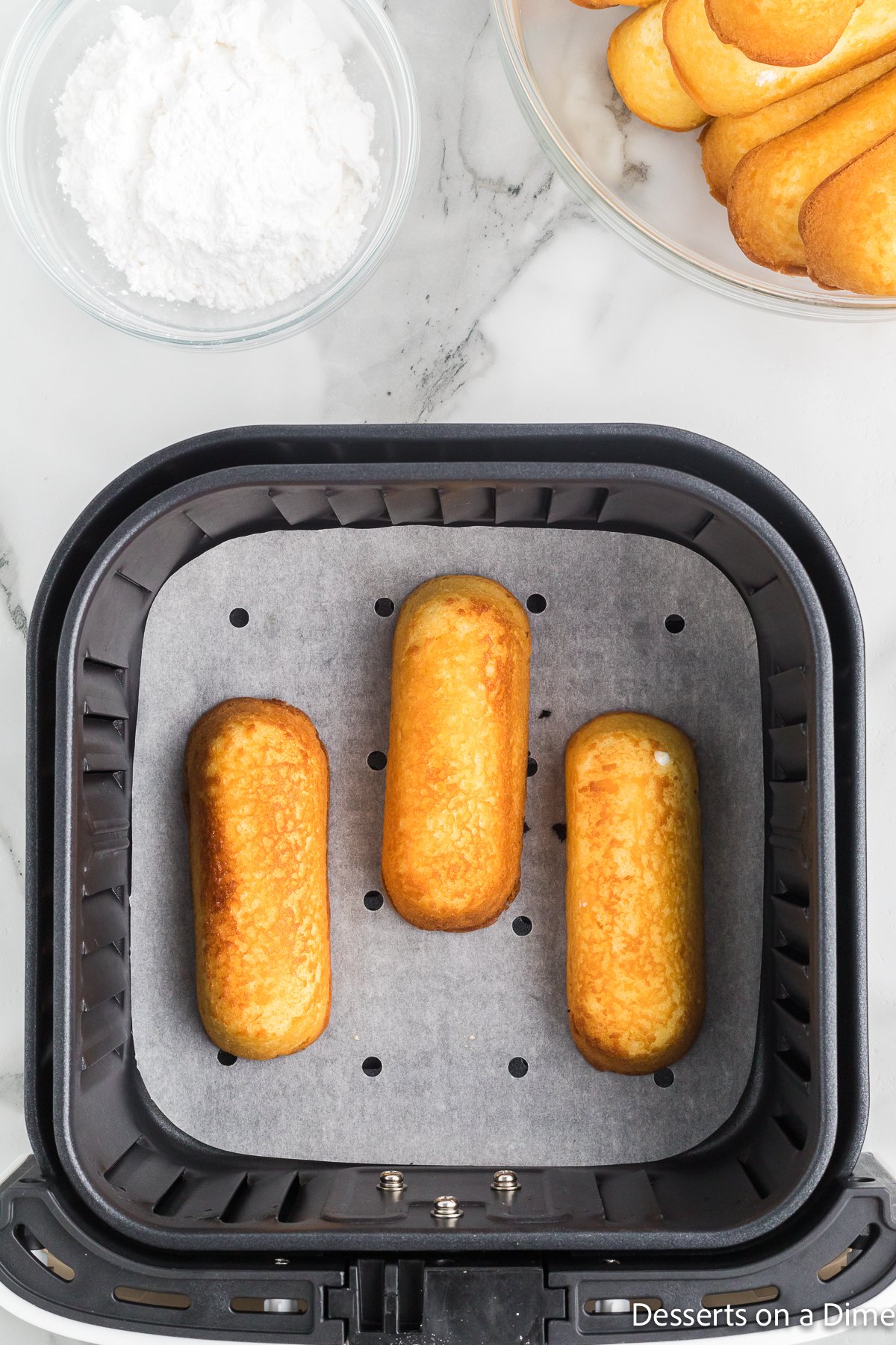 Twinkies in the air fryer after 1 minute.