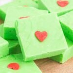 Squares of Grinch Fudge on a platter.