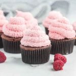 Chocolate cupcakes with raspberry frosting.