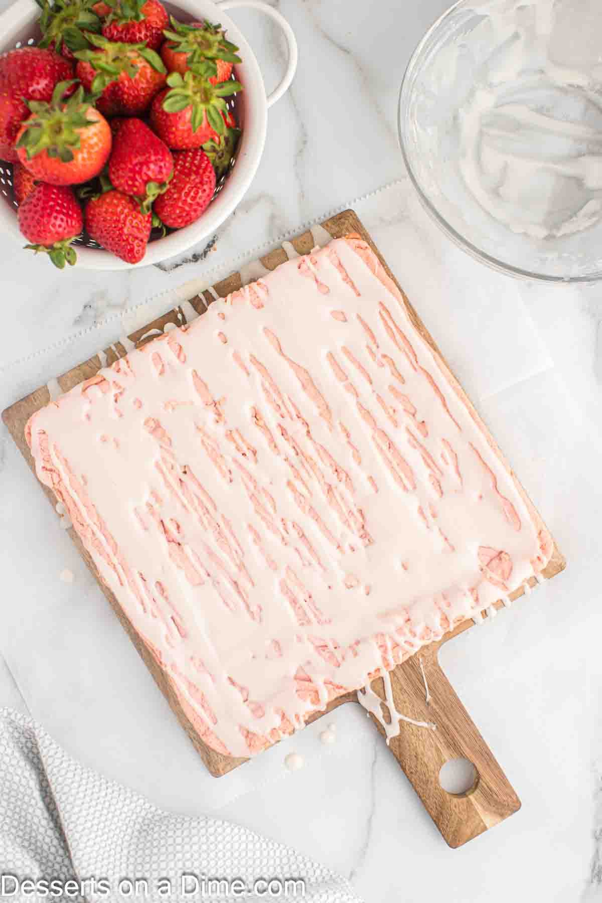 Glaze combined and drizzled over brownies.