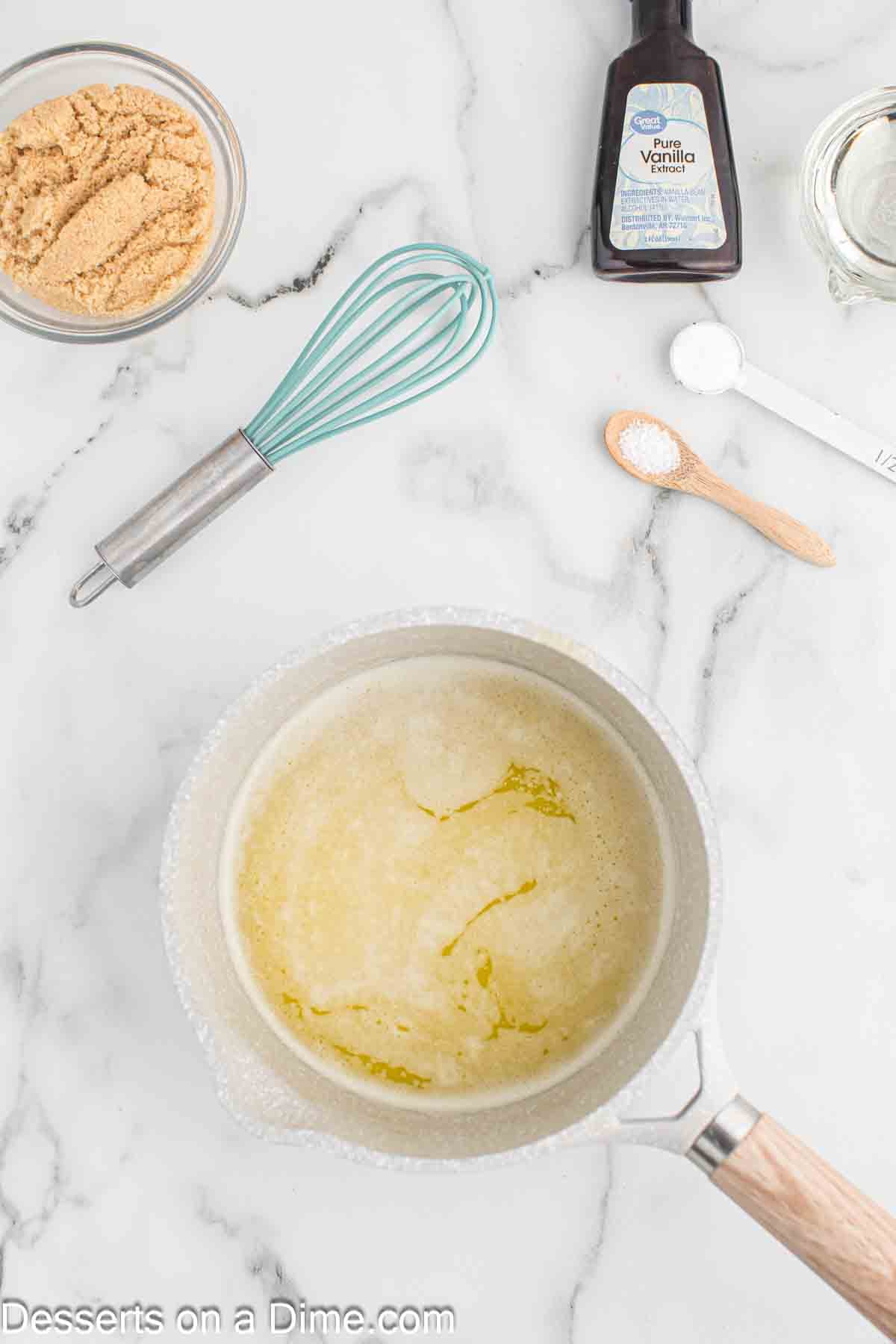 Saucepan of melted butter. 