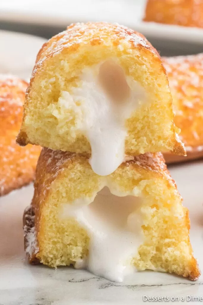 Fried twinkies cut in half with cream filling