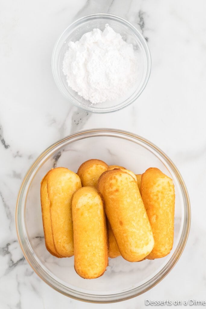 a bowl of twinkies and a bowl of powdered sugar