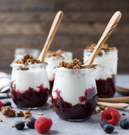 Parfait cups with spoons in each one.