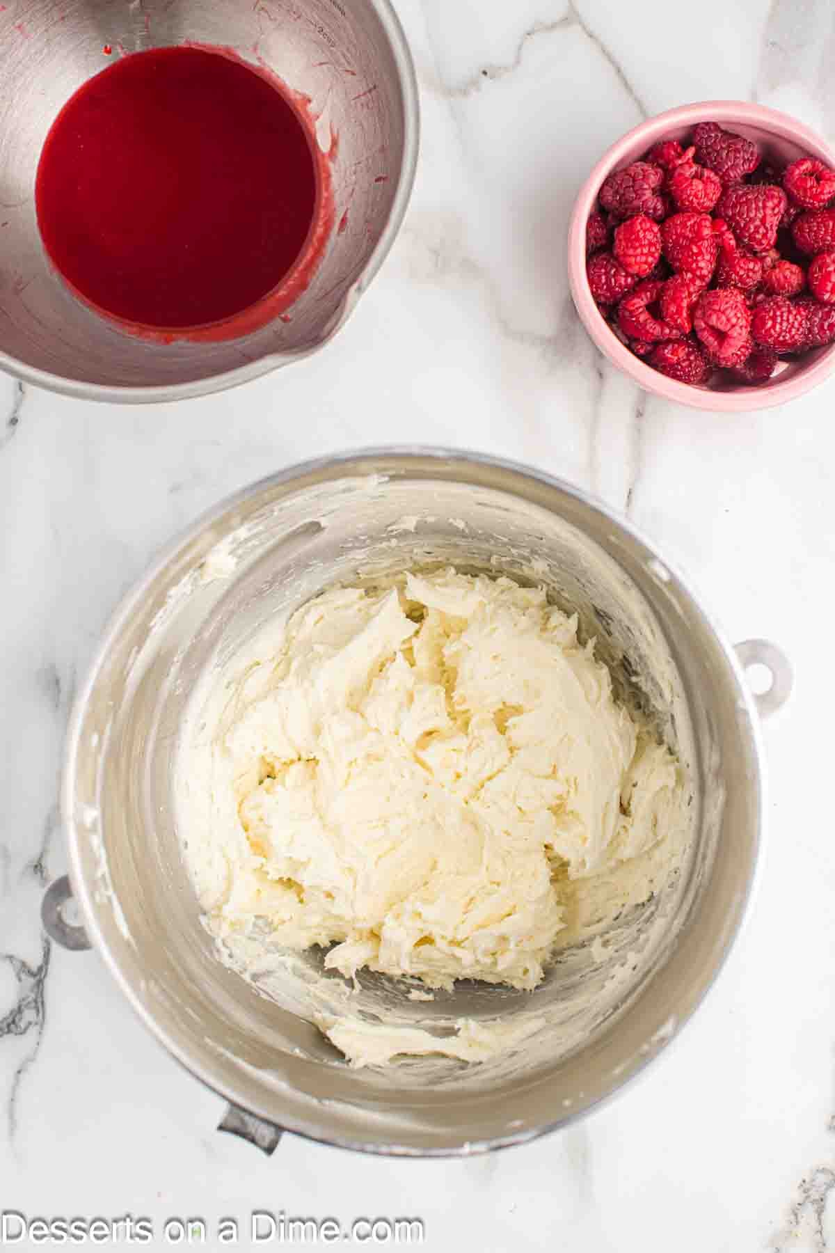 Butter and powdered sugar creamed together in a bowl.