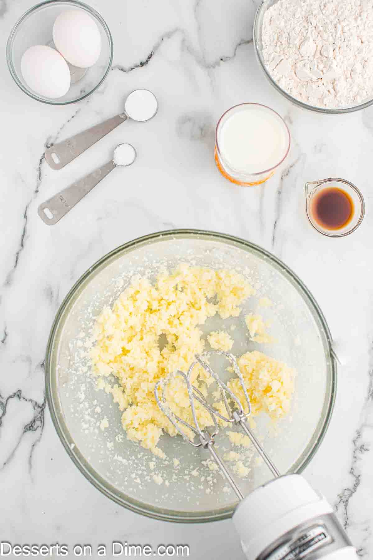 Butter in mixing bowl. 