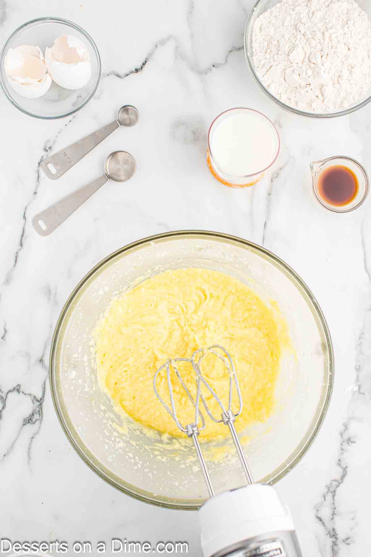 Mixing bowl with eggs added to mixture. 