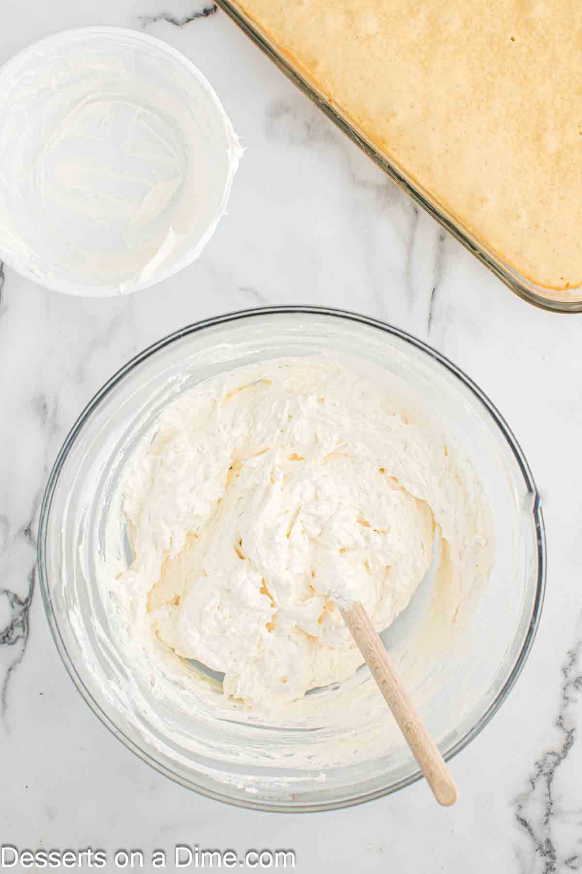 Whipped cream folded into bowl. 