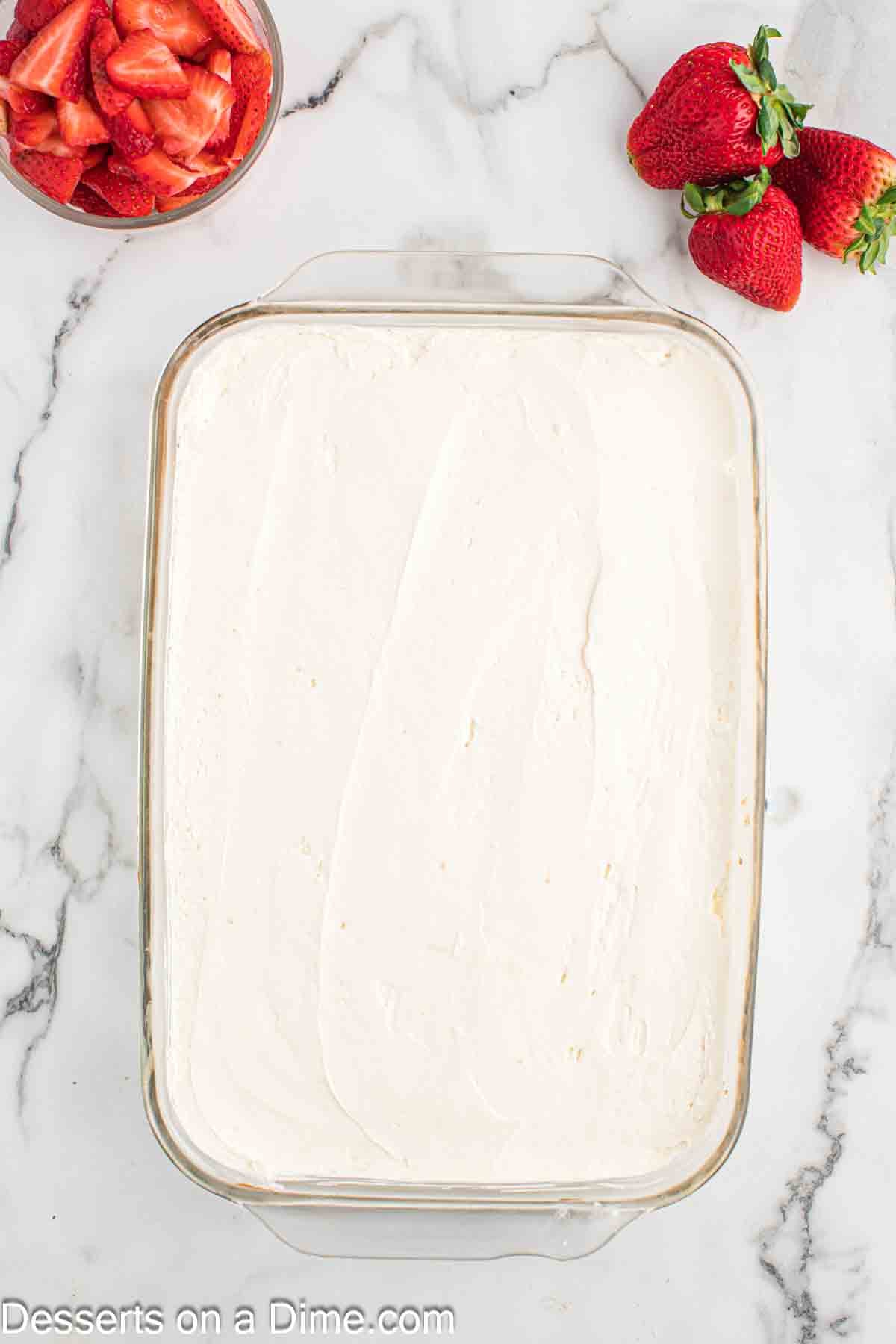 Frosting spread on cake. 