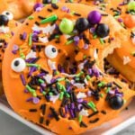 Halloween donuts with colorful sprinkles and eyes.