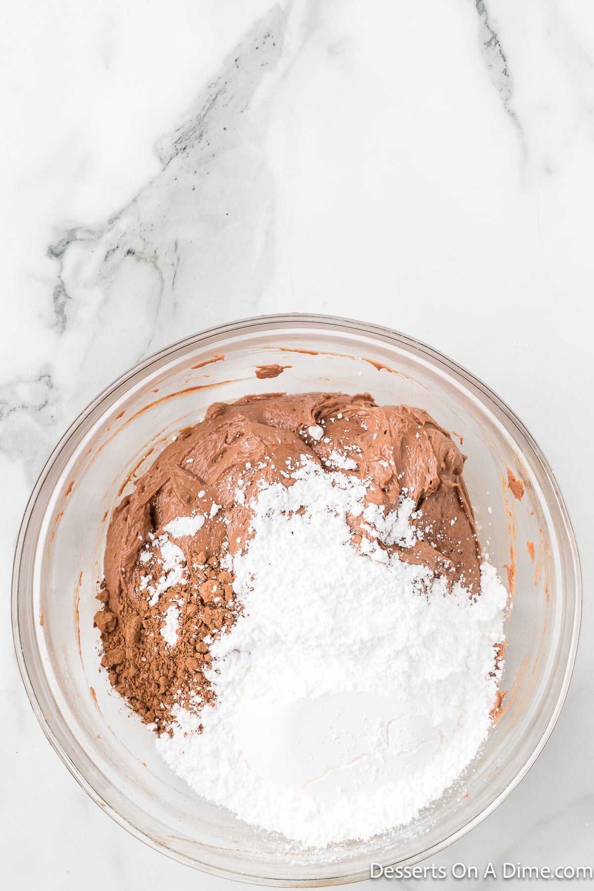 Cocoa powder and powdered sugar combined into Nutella mixture.