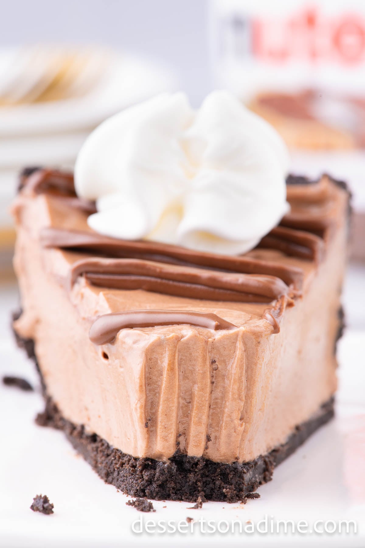 No bake nutella cheesecake sliced on plate. 