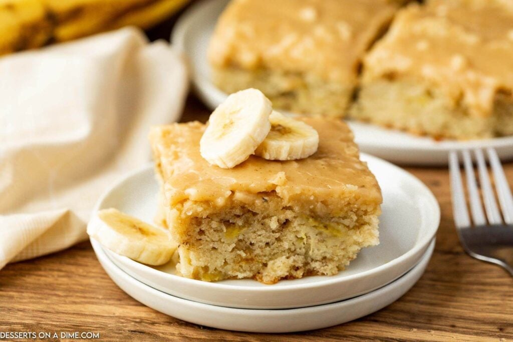 Banana Brownies cut into squares and placed on a white plate.