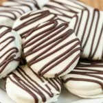 chocolate covered oreos with chocolate drizzle