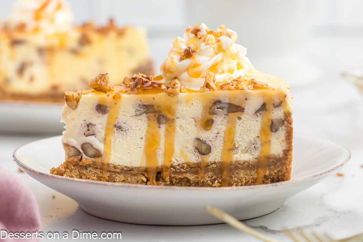 Slice of butter pecan cheesecake on a plate.