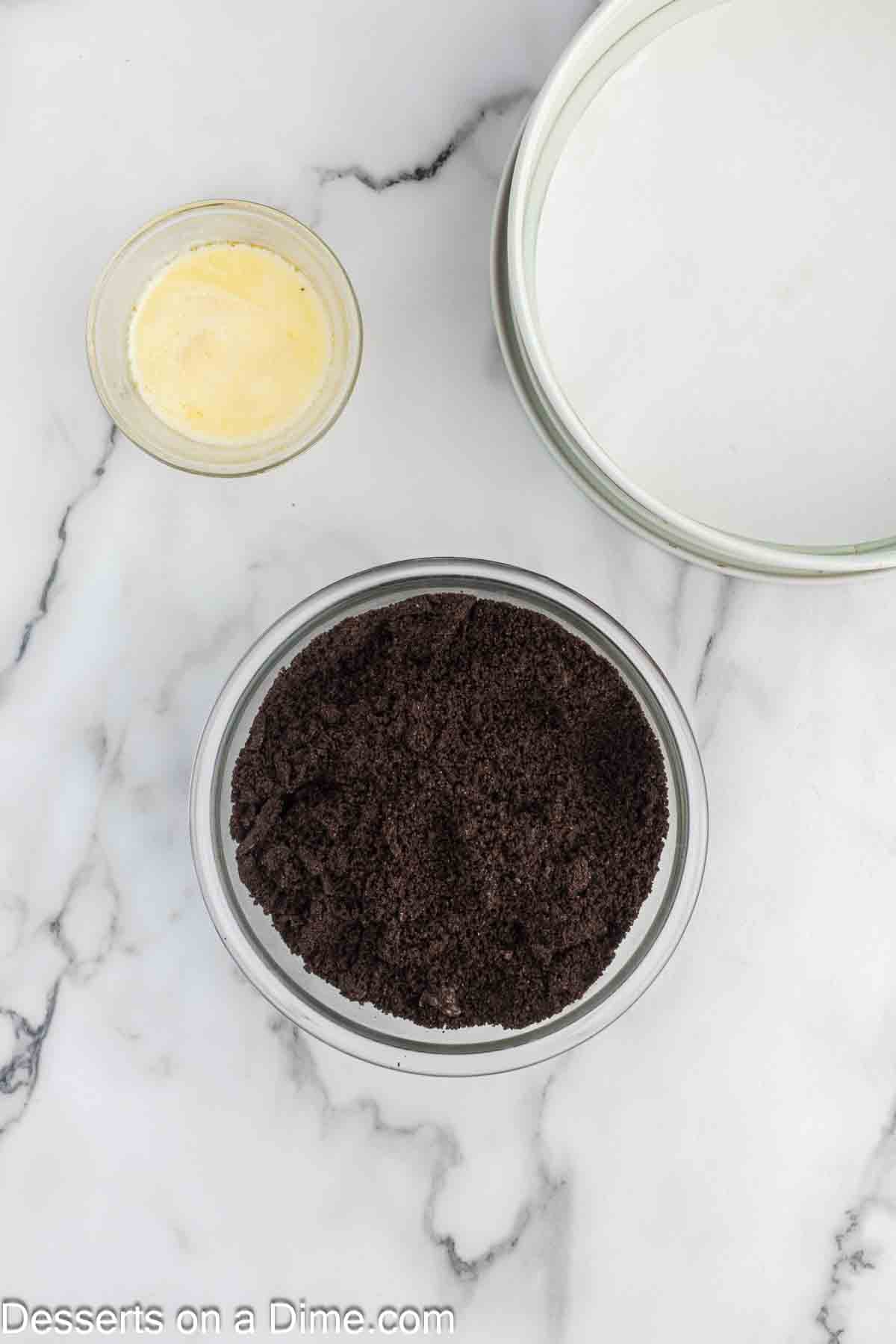 Ingredients needed - Oreo Cookies, butter, cream cheese, sugar, vanilla extract, nutella, eggs, heavy cream, whipped cream