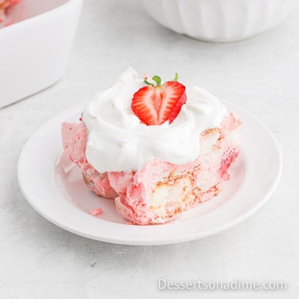 Strawberry Shortcake cut and sliced on a white plate.