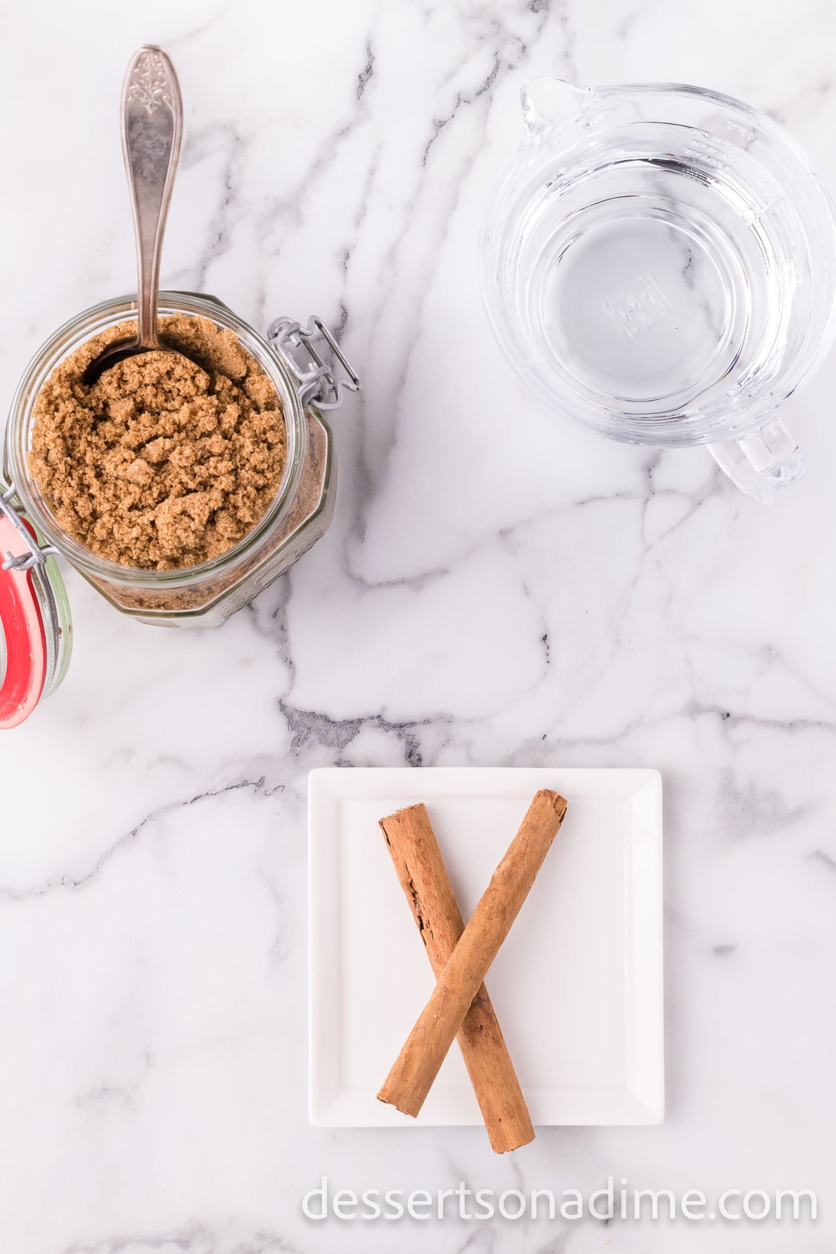 Ingredients for syrup - brown sugar, cinnamon sticks, water.