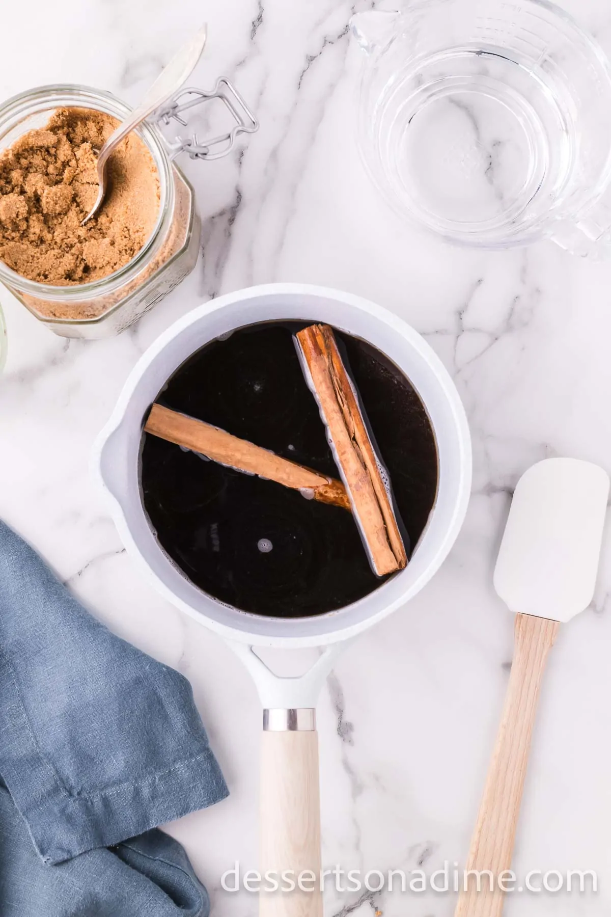 Cinnamon sticks added to pan.