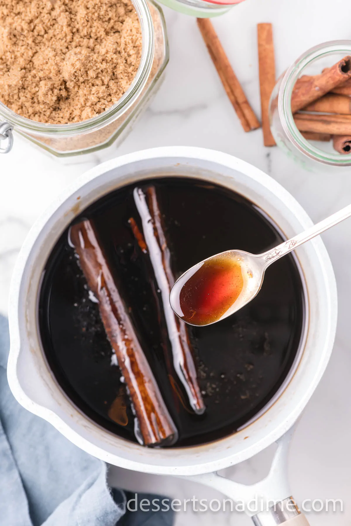 Cinnamon sticks simmered in mixture.