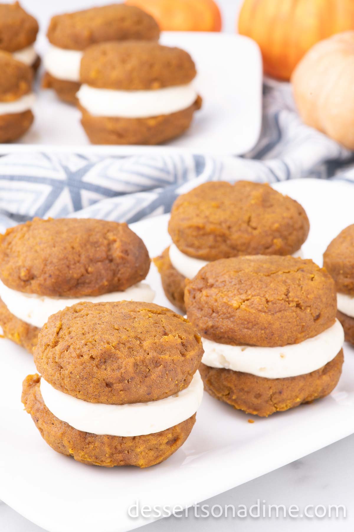 Pumpkin whoopie pies on a platter.