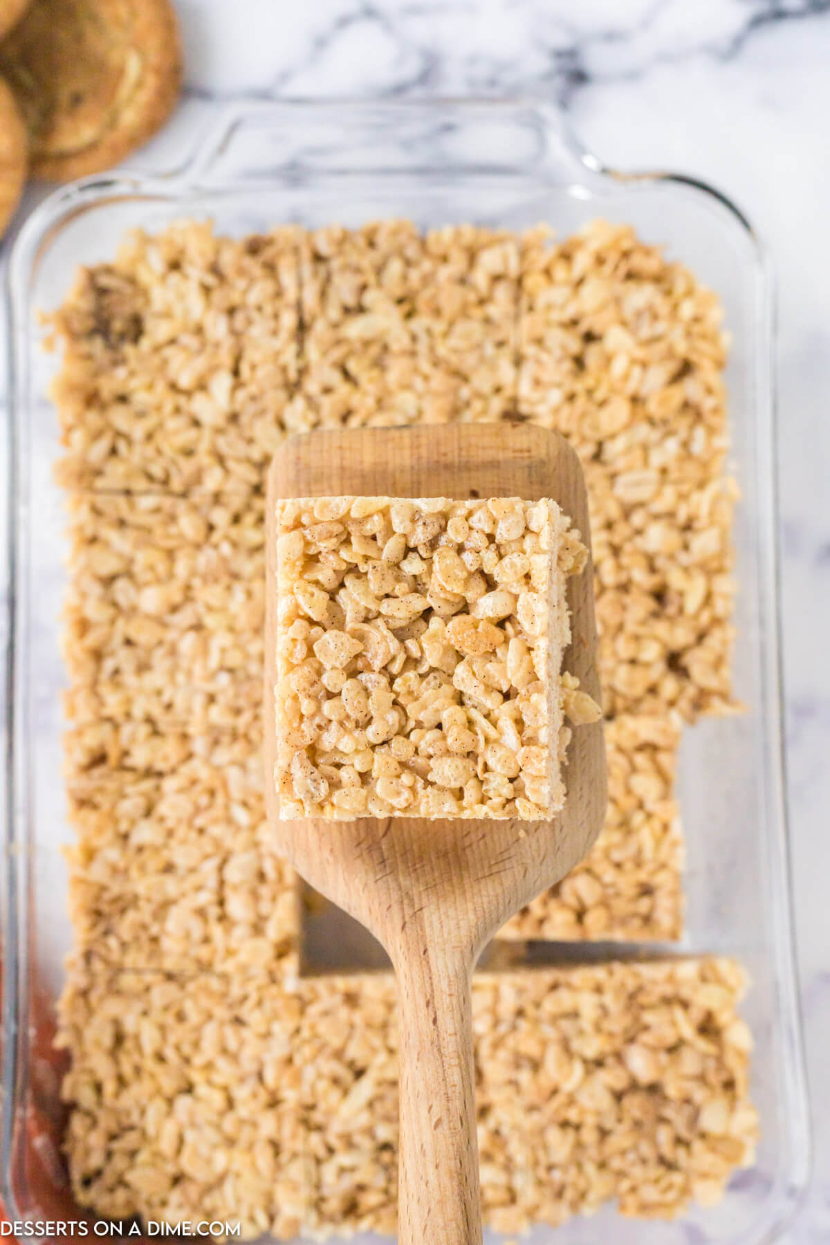Snickerdoodle Rice krispies cut and served on a spatula. 