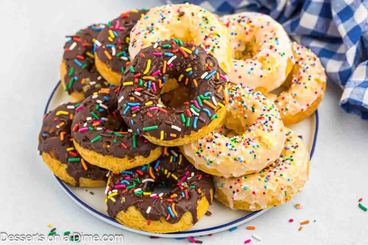 Platter of donuts with sprinkles.