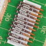 Chocolate pretzels with football pretzels on a football field.