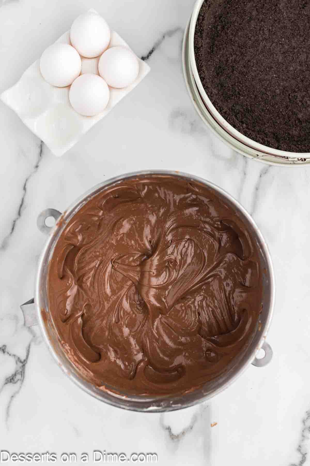 Mixing in the nutella, eggs and vanilla into the cream cheese mixture