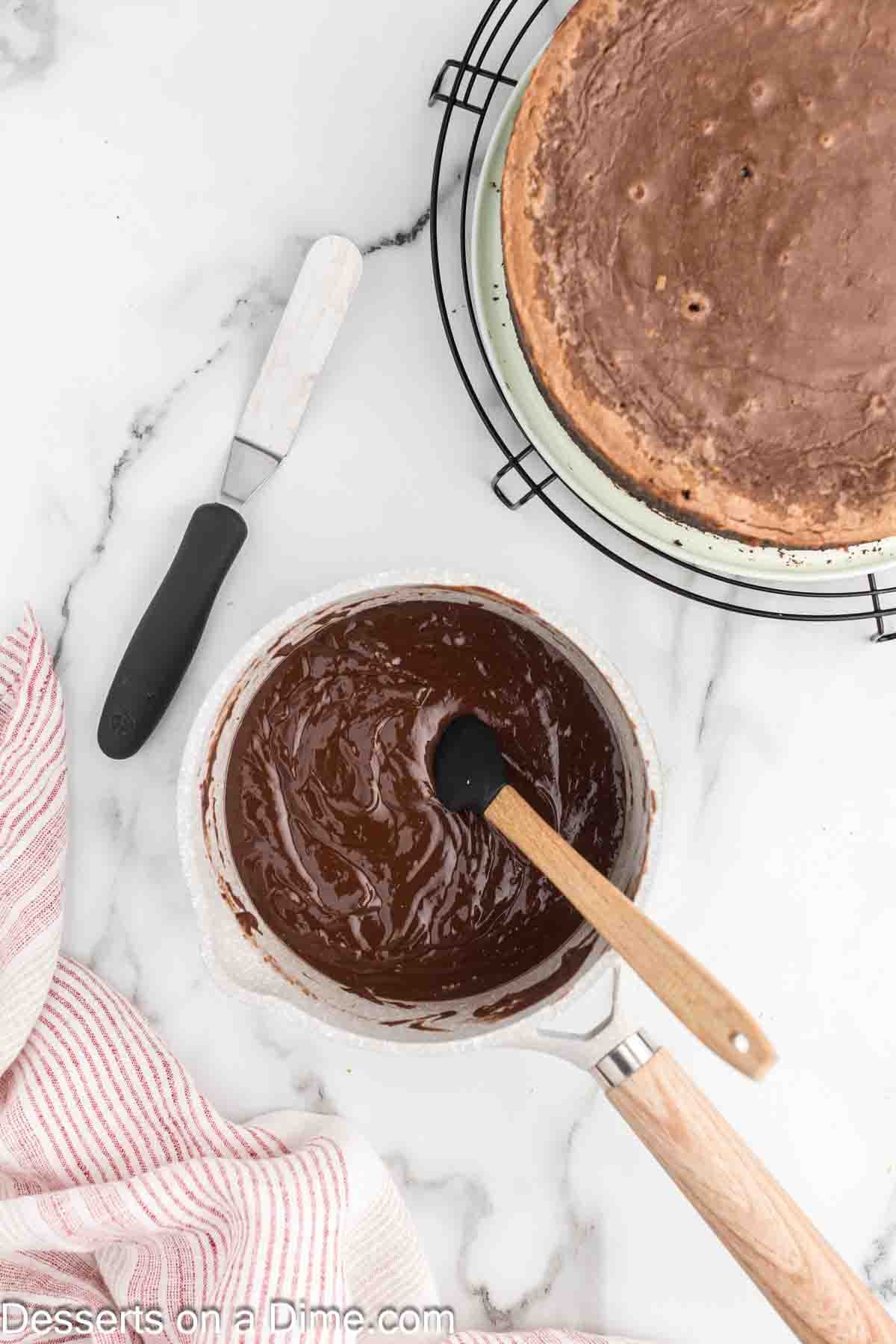 Heating mixture the heavy cream and nutella into the sauce pan