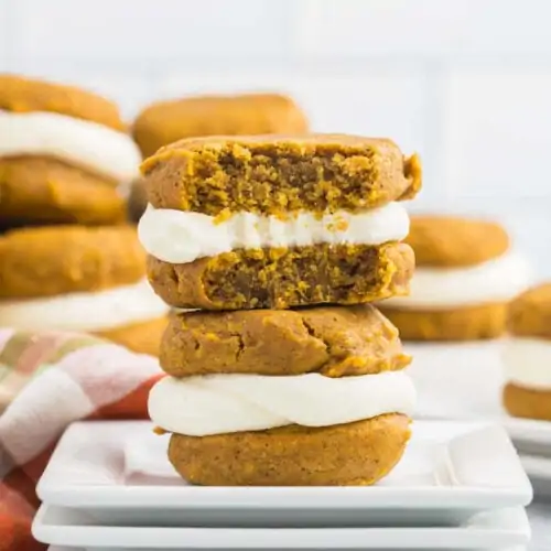 Pumpkin spice cookies stacked on a plate.