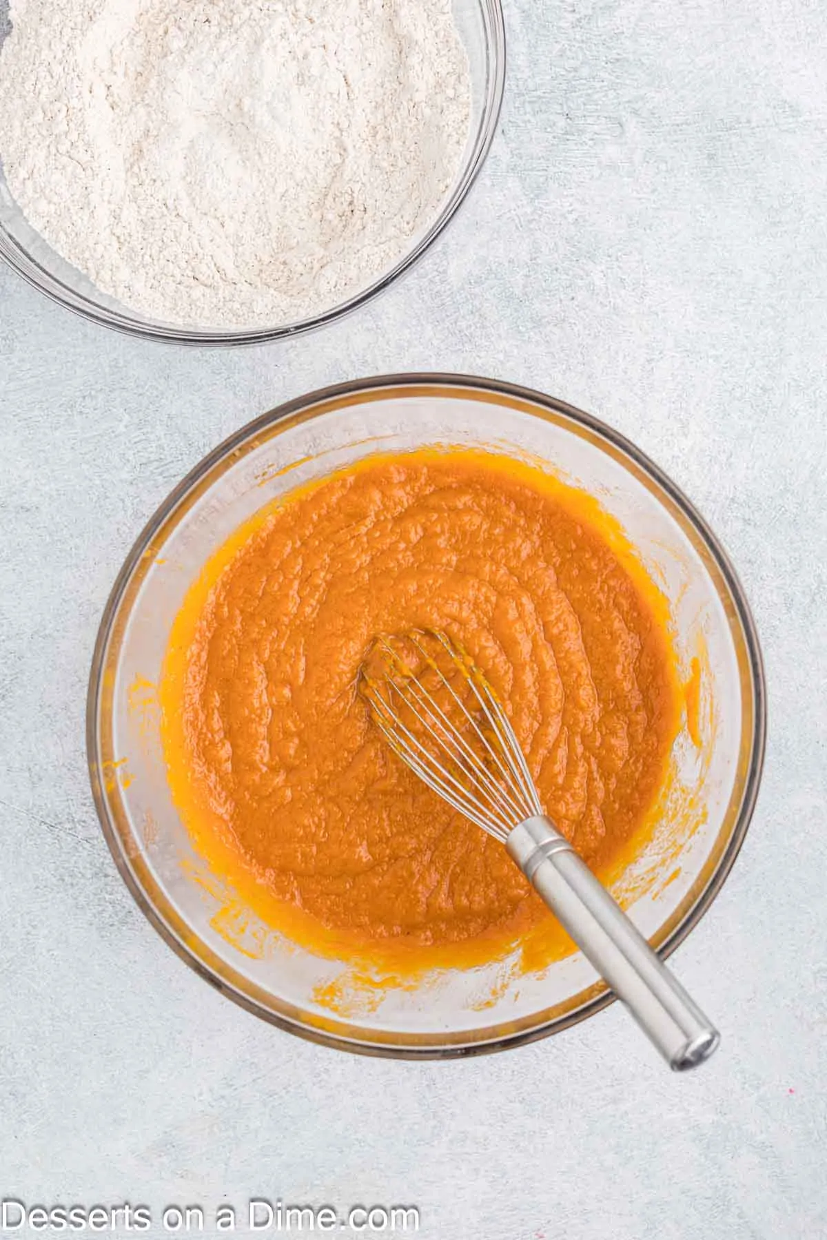 Vanilla added to pumpkin mixture in bowl.