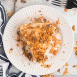Slice of Butterfinger pie on a plate.