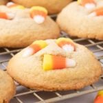 Candy corn cookies on a cooling rack.