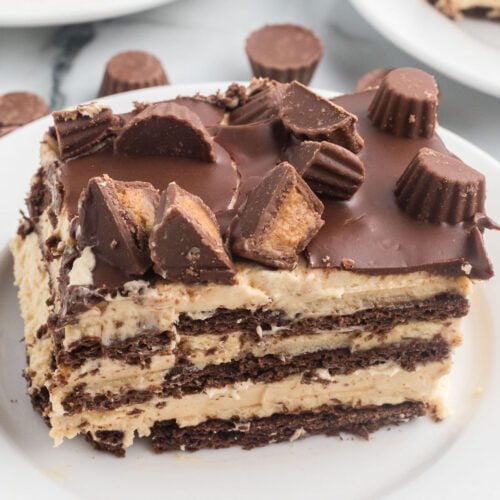 Slice of Peanut Butter Icebox cake on a white plate.