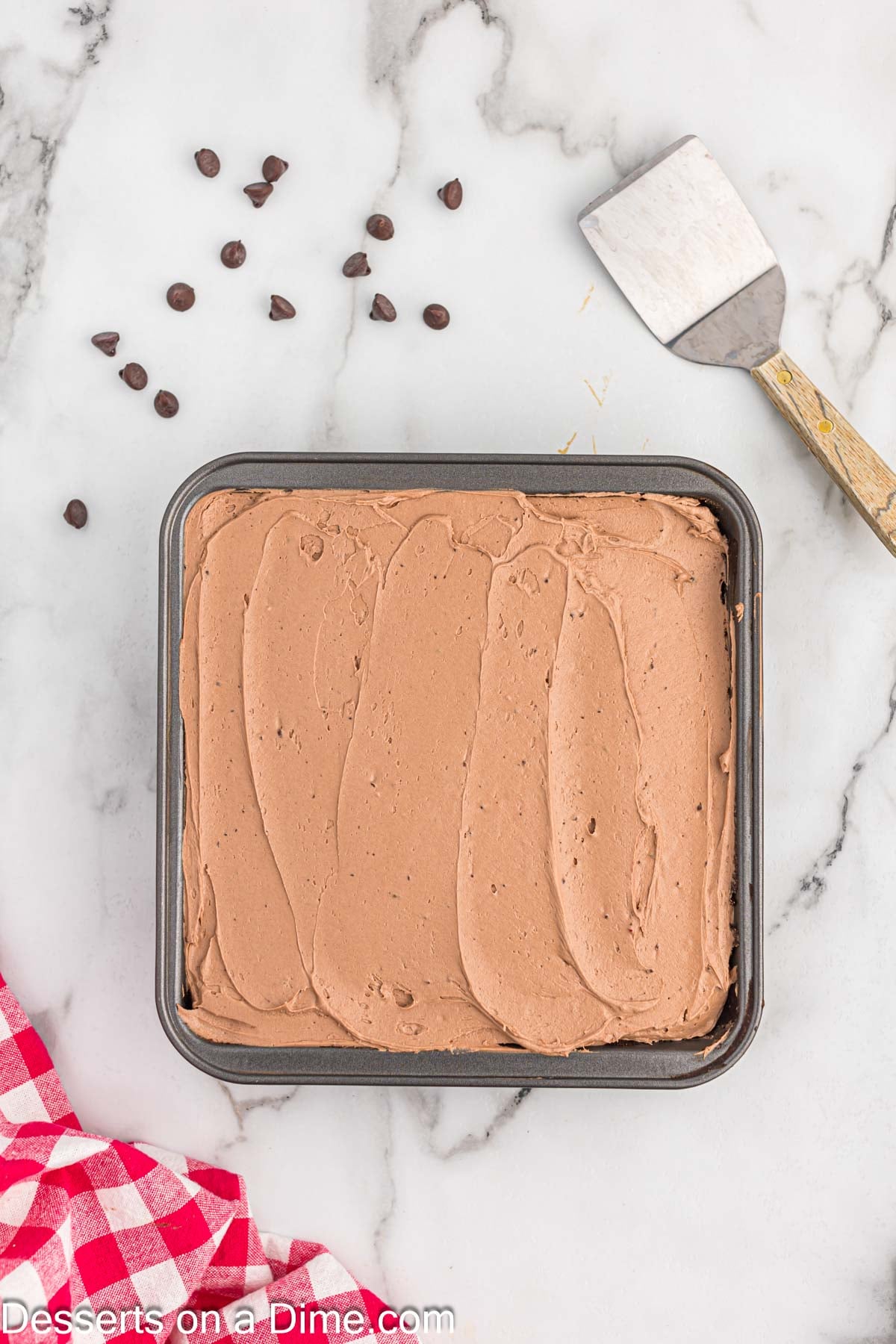 Frosting spread on cake until smooth. 