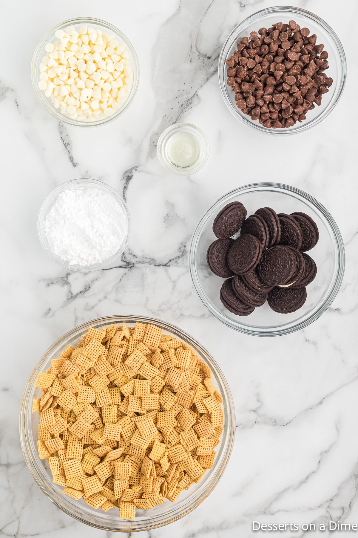 Ingredients for Oreo Puppy chow - chex cereal, oreos, powdered sugar, chocolate. 